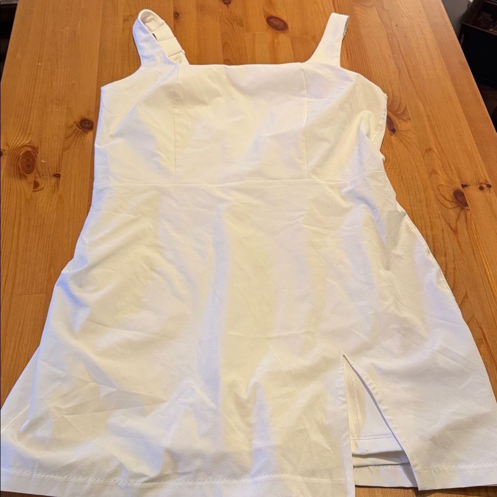 BNWOT, Under armour white exercise dress with cute slit, size medium